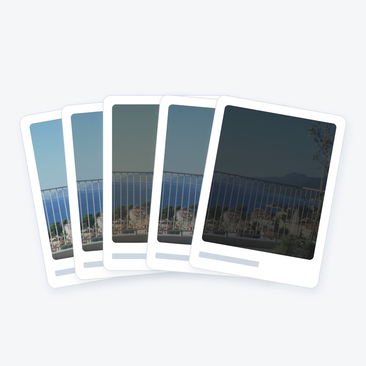 Car window tint sample cards from light to dark: charcoal, bronze and grey films