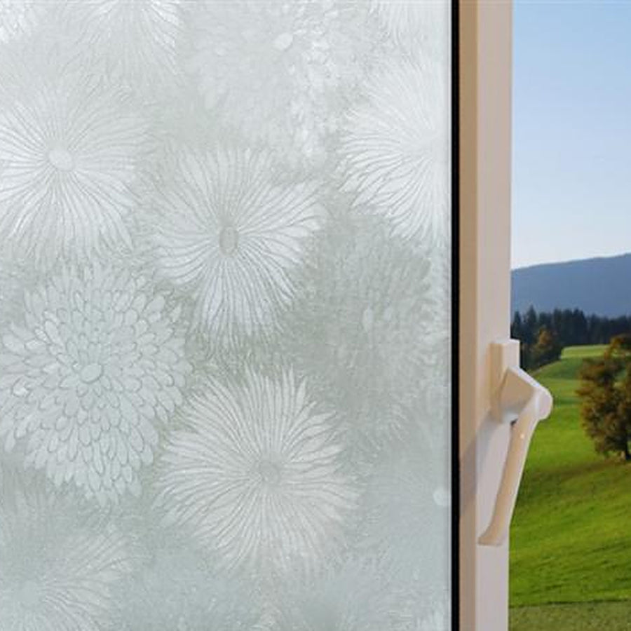Chrysanthemum window film on a window, with clear glass beside it