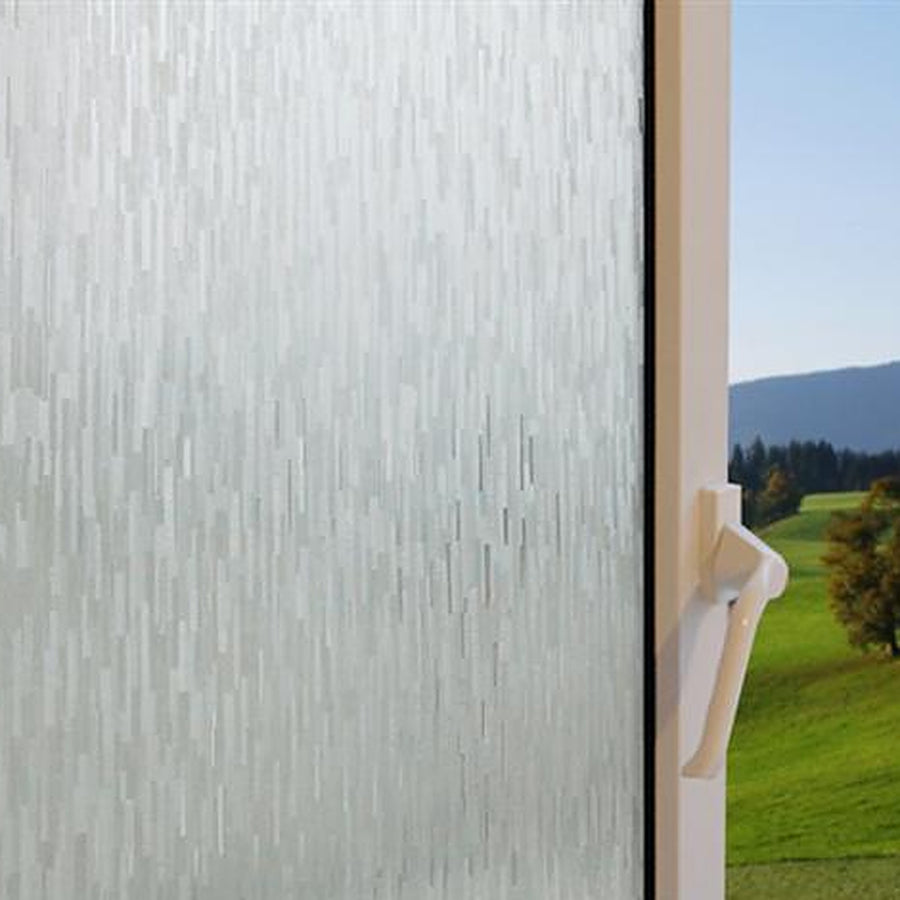 Clear Ice Forest window film on a window, with clear glass beside it