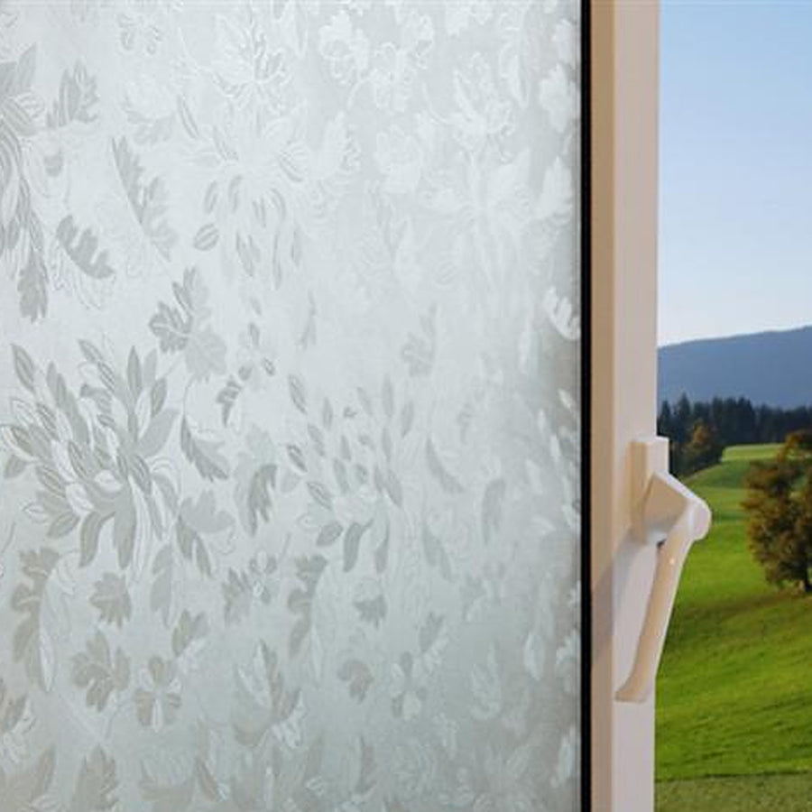 Flowers and Leaves window film on a window, with clear glass beside it