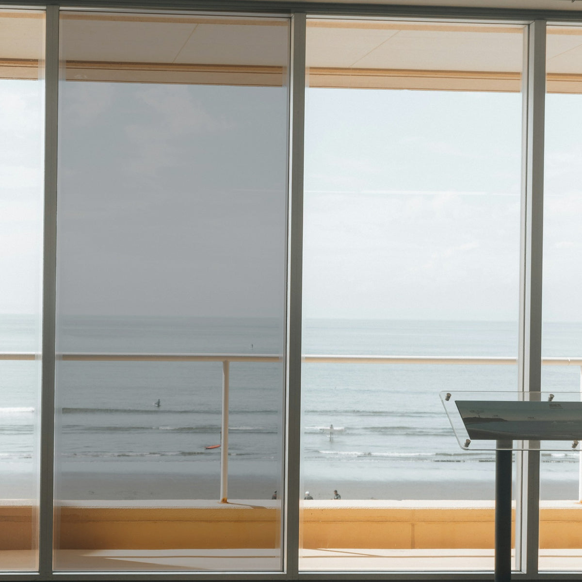 Simulated: Solar Gard TrueVue Window Film, TrueVue 40% Light, on the left window panel next to clear glass