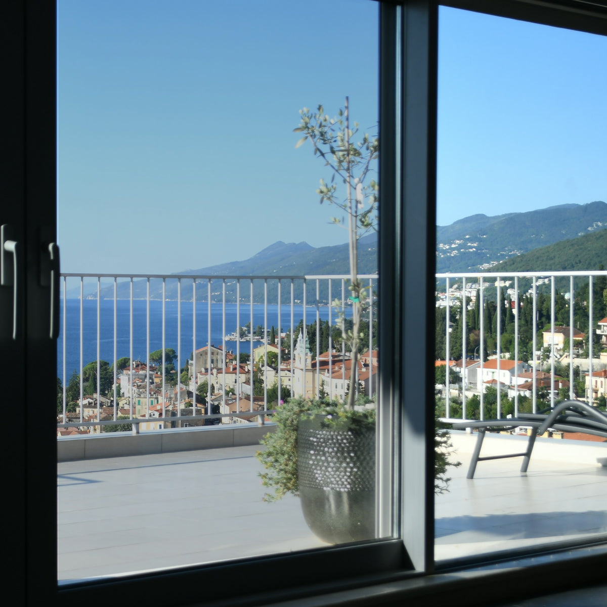 Simulated: SunTek Silver, 50% - Light, on the left sliding door pane next to clear glass