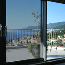 Simulated: SunTek Silver, 35% - Medium, on the left sliding door pane next to clear glass
