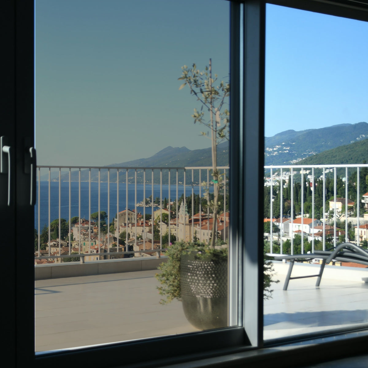 Simulated: SunTek Solar Bronze, 35% - Medium, on the left sliding door pane next to clear glass