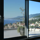 Simulated: SunTek Symphony Neutral, 50% - Light, on the left sliding door pane next to clear glass