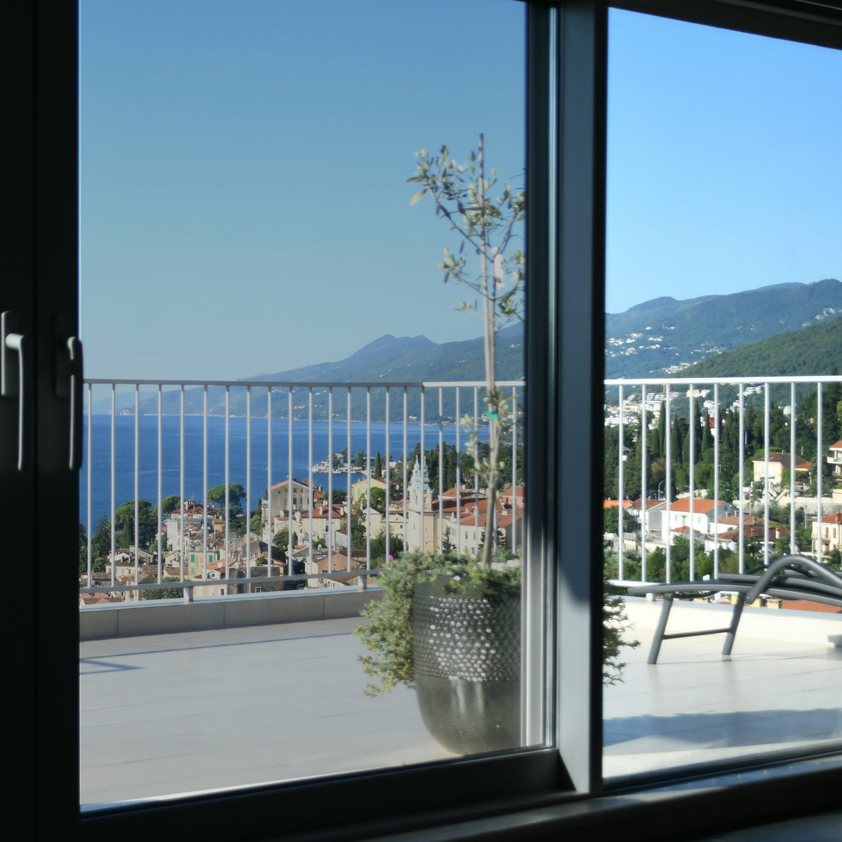 Simulated: SunTek Symphony Neutral, 50% - Light, on the left sliding door pane next to clear glass