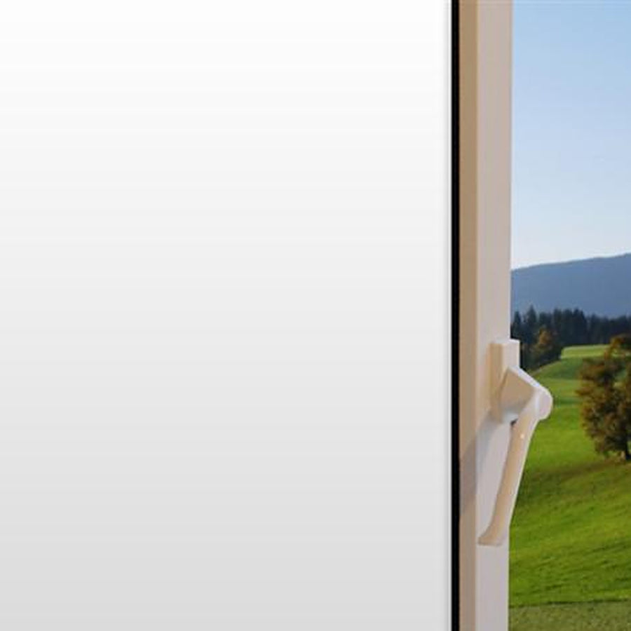 Whiteout Opaque window film on a window, with clear glass beside it